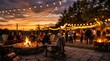 © Mark - Friends gathered around a stone fire pit at sunset with string lights