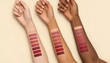 © AZIM - Three arms with different skin tones displaying various lipstick color swatches