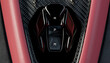 © ADDICTIVE STOCK - Close-up of sport car gear selector on carbon fiber trim
