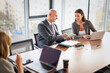 © gzorgz - Business people woking together in modern office