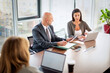 © gzorgz - Business people woking together in modern office