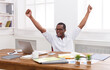 © Prostock-studio - Happy excited businessman celebrate. Winner, black man in office with laptop