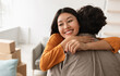 © Prostock-studio - Smiling young Asian woman hugging her boyfriend and holding house key on moving day, free space. Loving millennial couple embracing in their new home during relocation