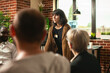 © DC Studio - Woman sharing her problem during therapy meeting Selective focus on white woman standing and sharing her problems at group therapy session. Young caucasian lady discussing about mental health.