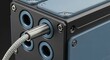 © Bakha - metal electrical connector plugged in cable close up with industrial design
