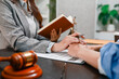 © PHOTO4U - Professional legal consultation between a lawyer and client discussing contracts, legal rights, case strategy, and document review in modern law office, representing justice, trust, and legal services