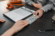 © PHOTO4U - Concept of bribery, corruption, and unethical business practices with cash offered during a legal contract meeting, highlighting financial crime, integrity, compliance, and corporate ethics.