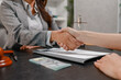 © PHOTO4U - Concept of bribery, corruption, and unethical business practices with cash offered during a legal contract meeting, highlighting financial crime, integrity, compliance, and corporate ethics.