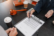 © PHOTO4U - Concept of bribery, corruption, and unethical business practices with cash offered during a legal contract meeting, highlighting financial crime, integrity, compliance, and corporate ethics.