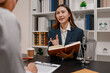© PHOTO4U - Professional legal consultation with a lawyer explaining legal procedures, reviewing contracts, and advising clients during a case discussion in a modern law office, representing justice and trust.