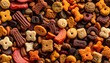 © adeeva Putri Azahra - A close-up, top-down view of a variety of dry dog food kibble shapes and colors, including bone, star, and biscuit forms, offering a healthy meal