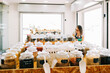 © Westend61 - Entrepreneur working on laptop in zero waste bulk spice shop