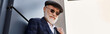 © LIGHTFIELD STUDIOS - A dapper senior gentleman with a grey beard confidently poses outdoors in smart casual attire on a cool autumn day.