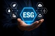 © Aitab - Business person holding glowing esg environmental social governance concept hologram