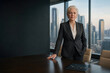 © Bartek - Senior executive Chief Algorithmic Officer in charcoal suit standing at head of boardroom table with tablet showing abstract network symbolizing AI oversight and corporate governance in modern office