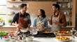 © Graphix - Cheerful friends in kitchen preparing food together cooking healthy meal laughing and enjoying time