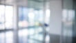 © Vhagar - A blurred interior space showcasing large windows and modern design. Natural light fills the area, creating a bright and airy atmosphere.