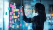 © TensorSpark - Woman plans on a glass board with sticky note in office, showing agile business strategy, adaptability, and corporate teamwork.