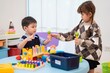 © Hip.hub - Kids play with colorful toys and engage in activities at a learning center in daytime