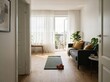 © Abir - Modern living room interior with yoga mat, dumbbells, and balcony access