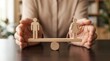© Zaiseefa - Conceptual representation of gender parity and equal balance using wooden human symbols.