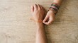 © SimpleDesignStudio - Indian woman tying rakhi thread on brother wrist celebrating sibling bond festival