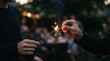 © SimpleDesignStudio - Two men lighting a sparkler together at an outdoor evening party, celebrating a special occasion with festive firework joy