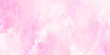 © Namira - Soft pink watercolor background with white specks and subtle texture for design and artistic projects