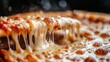 © Hamza - Pizza slice pulled away from the whole pie reveals long strings of melted mozzarella cheese.