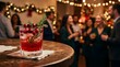 © Sophia - Red cranberry cocktail served on a wooden table at an office party event