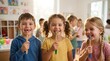 © Olga Ко - Dental hygiene education: Group of cheerful preschool children holding eco-friendly bamboo toothbrushes and smiling happily, including a boy with a missing front tooth, after a health lesson in a sunn