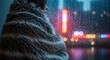 © yuli - Person wrapped in a cozy blanket looking out a rainy window at a vibrant city night.