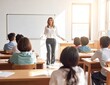 © Askhar Pro - Teacher leading a lesson in a bright classroom with students attentively listening.