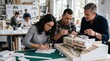 © Gabriel - Architects collaborating on building model