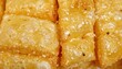 © Endin - Crispy golden brown fried dough sticks snack close up.