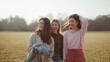 © bephoto - 旅先の公園で笑顔になる日本人女性三人の友情
