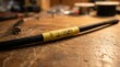 © God's blessing - Black electrical cable with yellow label on wooden workbench.