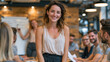 © pattozher - Confident Leader in Meeting: A poised woman leads a dynamic team in a modern office setting, with a whiteboard in the background suggesting collaboration and innovation.