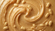 © Anuyj - Close up of tasty creamy peanut butter with peanut nuts. Food background with free place for text.