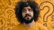 © Oleksandr - A bewildered man with curly hair and a beard gazes with wide eyes and a furrowed brow against a vibrant yellow background accented with hand-drawn question marks