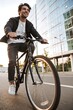 © Светлана Ефименко - Young Man Cycling Through Modern City Street During Morning Commute