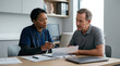 © Rido - Doctor Explains Medical Results To Patient In Office Consultation