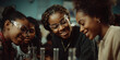 © Artificial South - Four young women in safety goggles smiling while looking down at something in a science lab, possibly conducting an experiment or looking at a discovery