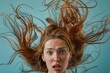 © nsit0108 - Woman with red hair looking surprised against blue background