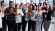 © Katsiaryna - Business people clapping their hands after a seminar