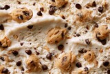 Macro view of vanilla ice cream with cookie dough chunks and chips filling the frame