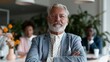 © CYBERPINK - Portrait of an elderly man with a white beard and mustache. he is wearing a light blue blazer and a white shirt with black polka dots.