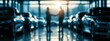© BlackLion - Two people shake hands in a car dealership during late afternoon sunlight