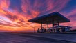 © Anat art - Gas station stands empty as the sunset paints the sky with warm colors and the pumps glow in the fading light of day