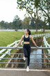 © PaeGAG - Young woman resting after exercise in a park